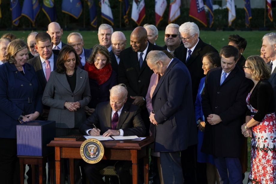 President Joe Biden signs the $1.2 trillion bipartisan infrastructure bill into law during a ceremony on the South Lawn of the White House in Washington on Nov. 15, 2021.