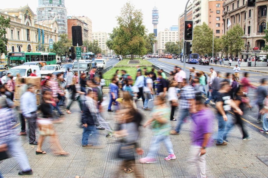 Residents walking on a sidewalk in Chile
